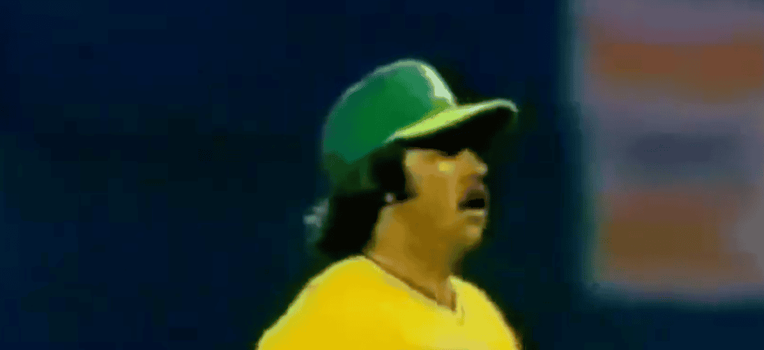 Image of Catfish Hunter, showcasing his powerful pitching style from the 70s.